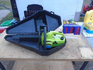 lot 108 image: Poulan 2000 gas chainsaw. With case. Fires on ether. May need carb cleaning. Bar &chain look new. As shown.