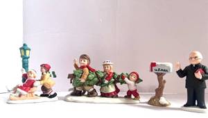 lot 28 image: 4 Vintage Lefton Christmas Village Figurines Mailbox, Priest, Kids w Sled and Kids with Tree