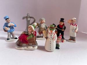 lot 29 image: 7 Vintage Lefton Christmas Village Figurines Butcher, Mailman, Chimney Sweep etc.