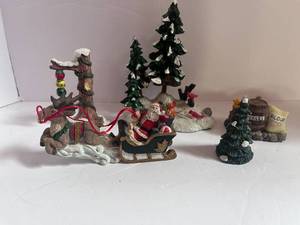 lot 35 image: 5 Unmarked Resin Christmas Village Figurines Santa, Trees and Cardinals ,etc..