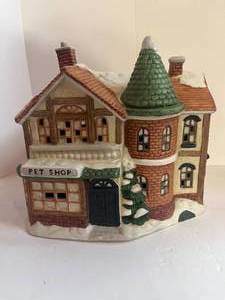 lot 52 image: 1993 Mervyns Christmas Village Pet Shop Quite Heavy