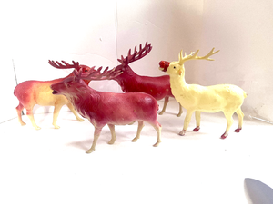 lot 85 image: 4 Antique Celluloid Reindeer One is missing a horn