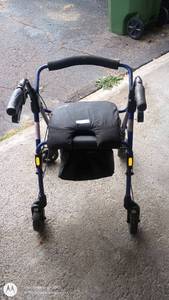 lot 28 image: Evolution Walker Rollator with Seat and Hand Brakes