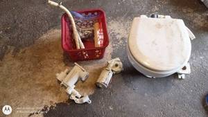 lot 53 image: RV Toilet and Plumbing Parts Lot