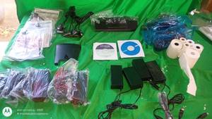 lot 85 image: Mixed Lot of Electronic Accessories, Power Adapters, Cables, CDs, and Receipt Rolls