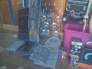 lot 150 image: Large Halloween Yard Decor Lot with Skeleton, Tombstones, Fencing, and Projection Lights