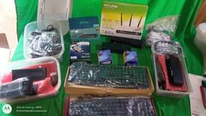 lot 159 image: IT Equipment Lot with Keyboards, TP-Link Wireless Access Point, 8-Port Switch, Hard Drive, and Adapters