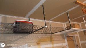 lot 244 image: Metal Overhead Garage Storage Shelf with Mounting Hardware