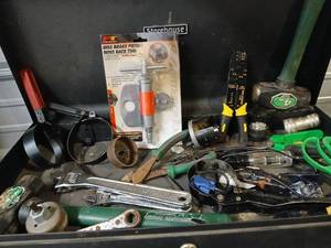 lot 1071 image: Toolbox Collection with Brake Piston Tool, Wire Stripper, Pruners, and Assorted Hand Tools