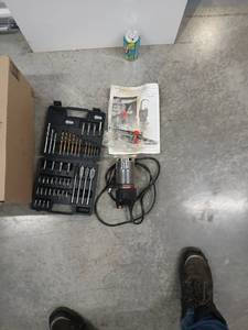 lot 1073 image: Router with Assorted Drill Bit Set and Manual