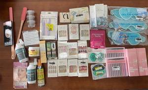 lot 219 image: Large Group of Beauty and Personal Care Items including Gel Eye Masks, Fake Nails, and Sprays
