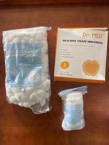 lot 312 image: Lot of Cotton Balls, Exfoliating Cotton Ovals, and Silicone Foam Dressings