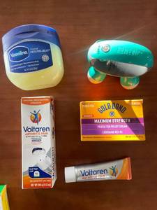 lot 334 image: Collection of Topical Pain Relief Products with Massager
