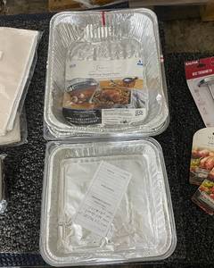 lot 395 image: Kitchenware Collection with Table Linens, Steam Pans, Meat Thermometer, Mixing Bowl, and Turkey Lacer Kits