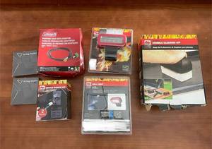 lot 420 image: Outdoor Grill Accessories Lot Including Griddle Cleaning Kit, Grill Light, Propane Hose, Airtag Holders, and Bottle Opener Set