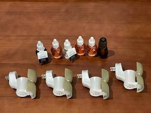 lot 445 image: Set of Fragrance Oil Plug-In Warmers with Oil Refills