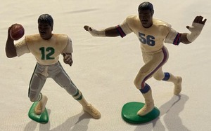 lot 127 image: Lawrence Taylor and Randall Cunningham Vintage Starting Lineup Football Figures