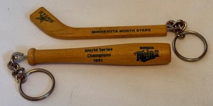 lot 144 image: Minnesota Twins and North Stars Vintage Keychains