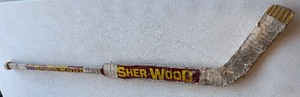 lot 3A image: Robb Stauber Team Issued  Heavily Used Sher-Wood Goalie Hockey Stick - University of Minnesota