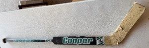 lot 216 image: Darcy Wakaluk Team Issued  Used Cooper Goalie Hockey Stick Minnesota North Stars
