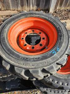 lot 34 image: Set of 5 Goodyear Trackman 26560R15 Tractor Tires with Orange Rims