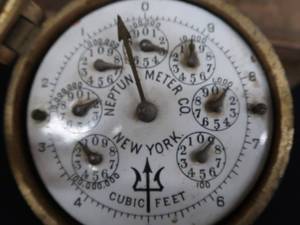 lot 21 image: ANTIQUE BRASS AND PORCELAIN WATER METER