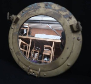 lot 66 image: BRASS PORT HOLE MIRROR