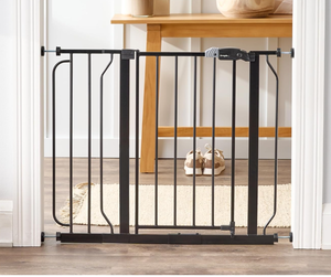 lot 102 image: Regalo Easy Step 38.5-Inch Wide Walk Thru Baby Gate, Includes 6-Inch Extension Kit, Pressure Mount Kit, Wall Cups, Black 29-38.5W x 30H