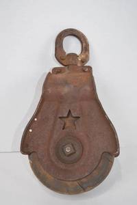 lot 15 image: Antique Cast Iron and Wood Barn Pulley with Star Cutout