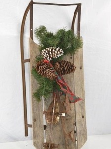 lot 33 image: Vintage Wooden Sled with Pinecone Holiday Decor And Antique Ice Skates, 32 x 13 in