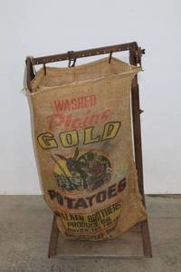 lot 79 image: Vintage Plains Gold Potatoes Burlap Sack with Metal Stand