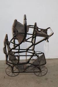 lot 80 image: Antique Metal Doll Stroller Frame with Worn Fabric