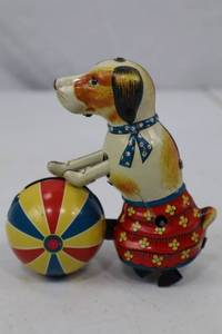lot 129 image: Vintage Tin Wind-Up Toy Dog with Ball - Colorful Circus Style