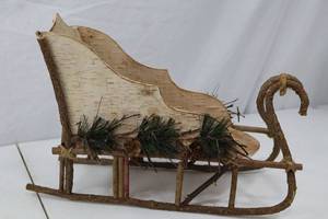 lot 132 image: Rustic Christmas Sleigh Centerpiece with Pinecone Accents