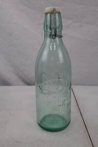 lot 154 image: Vintage Embossed Milk Bottle with Wire Bale Lid, Cow Motif
