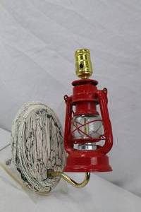 lot 166 image: Rustic wall-mounted lantern-style lamp with distressed base