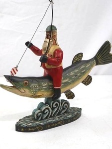 lot 171 image: Folk Art Fisherman Santa Riding Fish Figurine, 10 Inch Tall