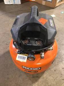 lot 46 image: RIDGID 6 Gal. 150 PSI Portable Electric Oil-Free Jobsite Pancake Air Compressor with Dual Pressure Gauges and 2-Quick Couplers Customer Returns See Pictures