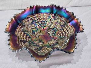 lot 49 image: Carnival Glass Bowl with Ruffled Edges and Grape and Leaf Pattern