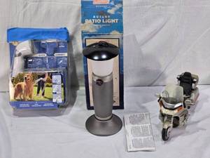 lot 84 image: Coleman Butane Patio Light Model #9930-750, Quick Connect Shower System (hose and end only), and Toy Goldwing Model