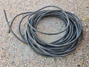 lot 92 image: Coiled Rubber Hose Pieces - Appears to be Soaker Hose Maybe