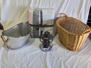lot 95 image: Silver Metal Bucket, Wicker Basket, and Victorias Secret Blanket with Candle Lantern