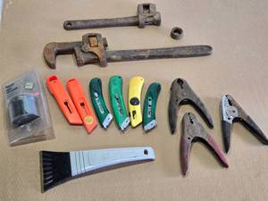 lot 105 image: Lot of Mixed Hand Tools including Utility Knives, Spring Clamps, Old Pipe Wrench, Broken Pipe Wrench