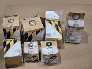 lot 115 image: NAPA Gold Oil and Fuel Filters including 1344, 3546, 1806, 365, 1374, 3531