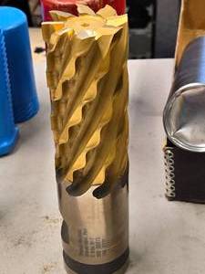 lot 26 image: Regal-Beloit Roughing End Milling Bit - 4 Flute M-7 with Case