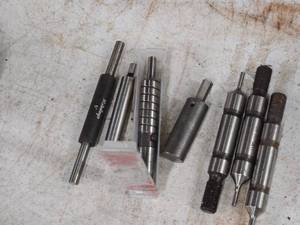 lot 192 image: Drill Chuck Arbors (x3), Mitutoyo 5 Micrometer (x1), Slug Free Punch Press Die (x1)