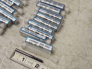 lot 215 image: Lot of (9) 316 4 Flute Carbide End Mill Bits (in original packaging)