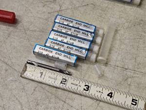 lot 214 image: Lot of (5) 316 4 Flute Double Ended End Mill Bits (in original packaging)