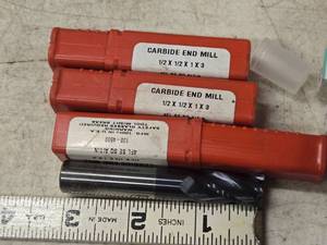 lot 213 image: Lot of (3) 12 Carbide 4 Flute End Mill Bits (in original packaging)