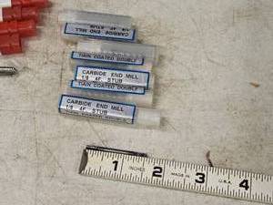 lot 209 image: Lot of (7) 18 4 Flute Double Ended End Mill Bits (in original packaging)